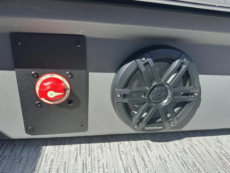 Slide: The Image of 2025 Bennington 21 SSR Quad Bench boat speaker and power switch detail. - 9