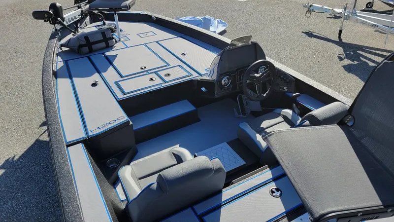 Slide: The Image of 2025 Xpress H20C Crappie boat interior with Yamaha Vmax 175, showcasing seating and controls. - 10