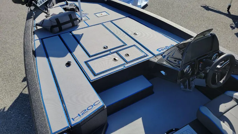 Slide: The Image of 2025 Xpress H20C Crappie boat interior with Yamaha Vmax 175, featuring sleek design and storage compartments. - 11