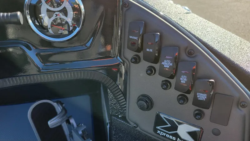 Slide: The Image of Dashboard controls of 2025 Xpress H20C Crappie boat with Yamaha Vmax 175 engine. - 16