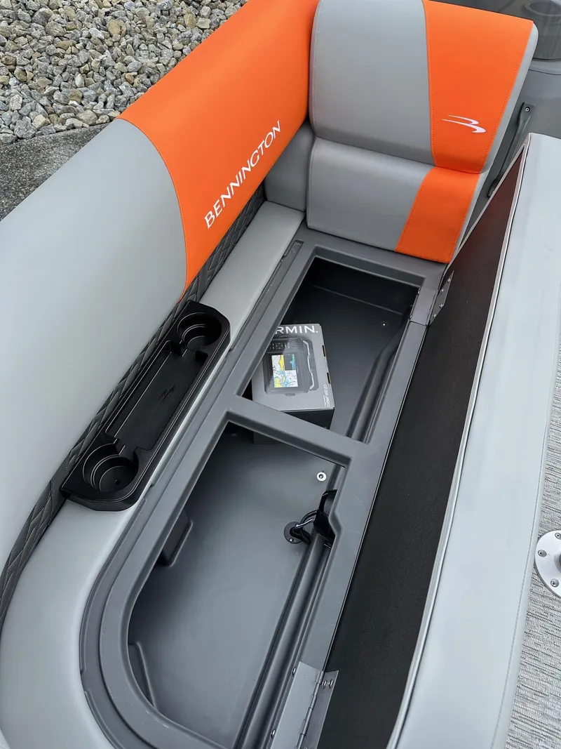 Slide: The Image of 2025 Bennington 22 SSB Swing Back boat seat with storage compartment and Garmin box. - 11