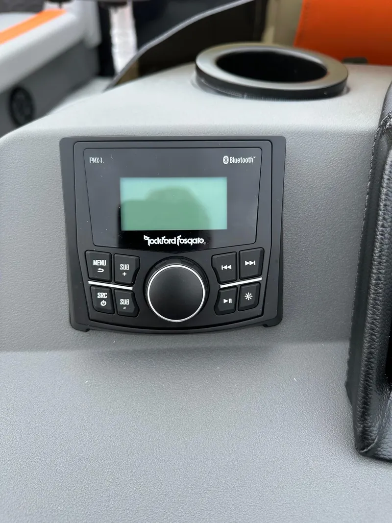 Slide: The Image of Rockford Fosgate Bluetooth stereo system in 2025 Bennington 22 SSB Swing Back boat. - 24