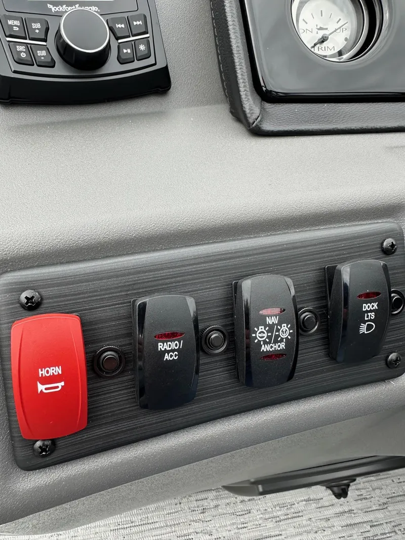 Slide: The Image of Control panel of 2025 Bennington 22 SSB Swing Back boat with switches and gauges. - 27