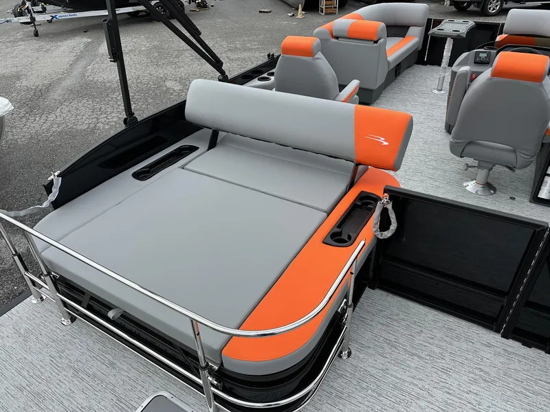 Slide: The Image of 2025 Bennington 22 SSB Swing Back boat with orange and gray seating. - 29