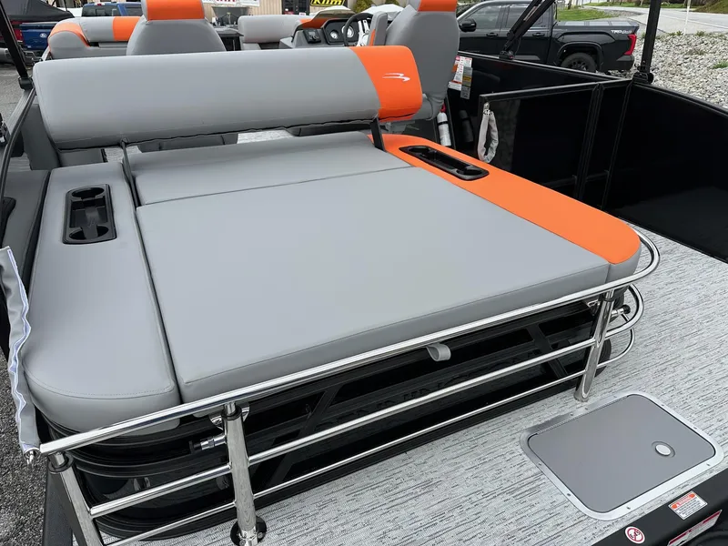 Slide: The Image of 2025 Bennington 22 SSB Swing Back boat with gray and orange seating. - 30