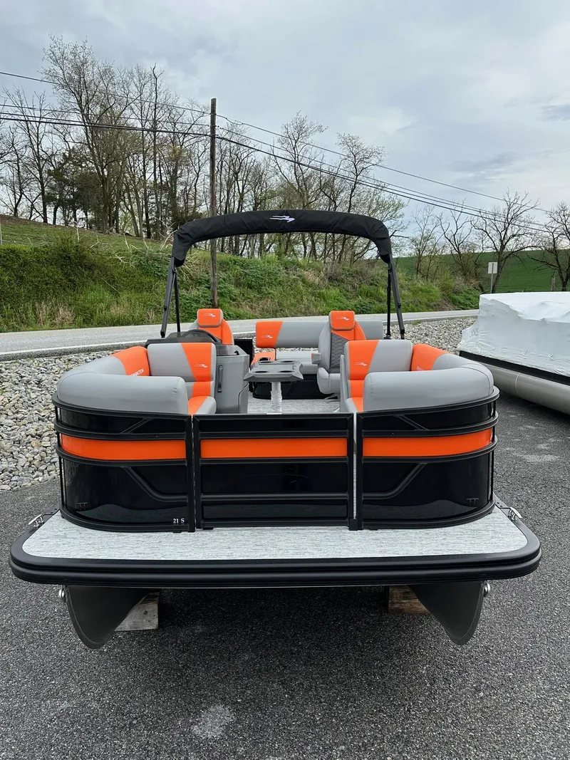 Slide: The Image of 2025 Bennington 22 SSB Swing Back pontoon boat with orange and gray seating. - 5