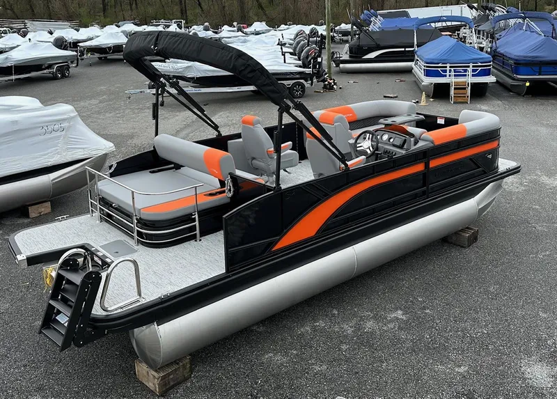 Slide: The Image of 2025 Bennington 22 SSB Swing Back pontoon boat in stock, black and orange design. - 9