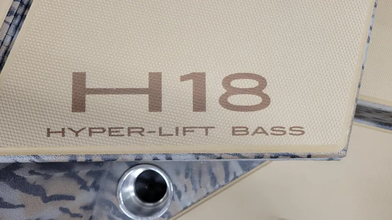 Slide: The Image of 2025 Xpress H18 Hyper-Lift Bass boat detail with textured surface. - 6