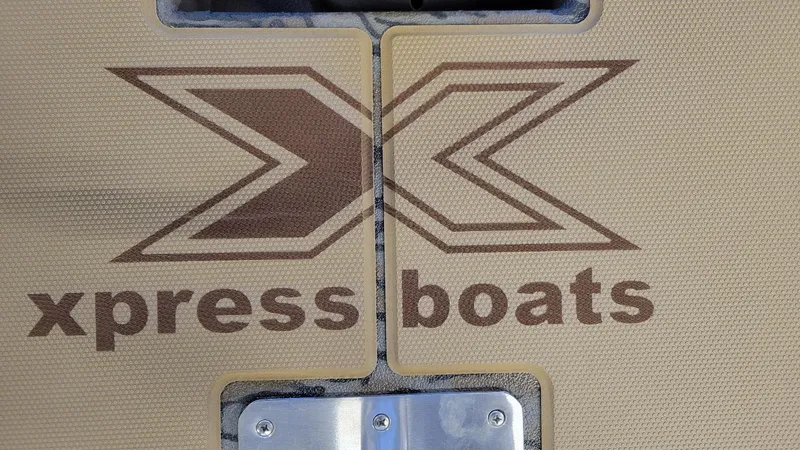Slide: The Image of Xpress Boats logo on 2025 H18 Bass model with Yamaha Vmax 115 engine. - 7