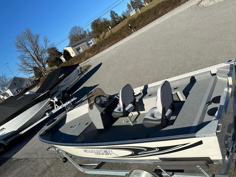 Slide: The Image of 2025 Smoker Craft 16 Angler Patriot SC fishing boat, in stock, parked outdoors. - 10