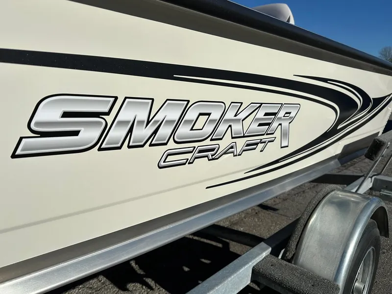 Slide: The Image of 2025 Smoker Craft 16 Angler Patriot SC fishing boat, side view with logo. - 11
