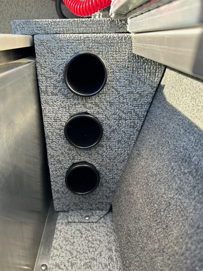 Slide: The Image of 2025 Smoker Craft 16 Angler Patriot SC fishing boat interior detail with rod holders. - 14