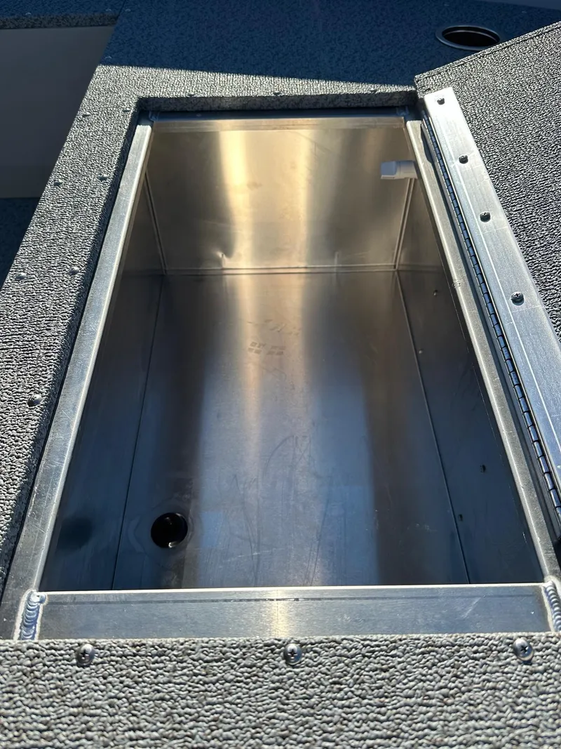 Slide: The Image of 2025 Smoker Craft 16 Angler Patriot SC fishing boat livewell compartment. - 17