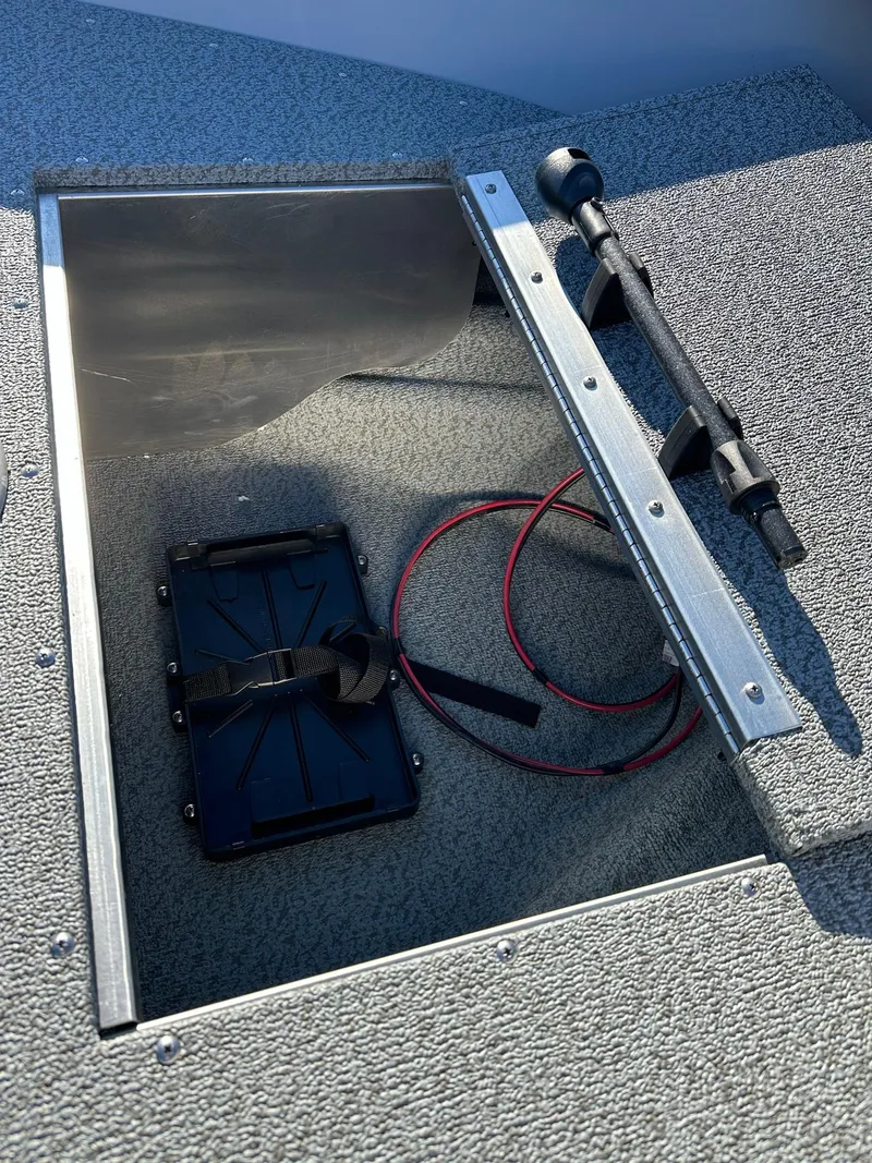 Slide: The Image of Open storage compartment in 2025 Smoker Craft 16 Angler Patriot SC fishing boat. - 18