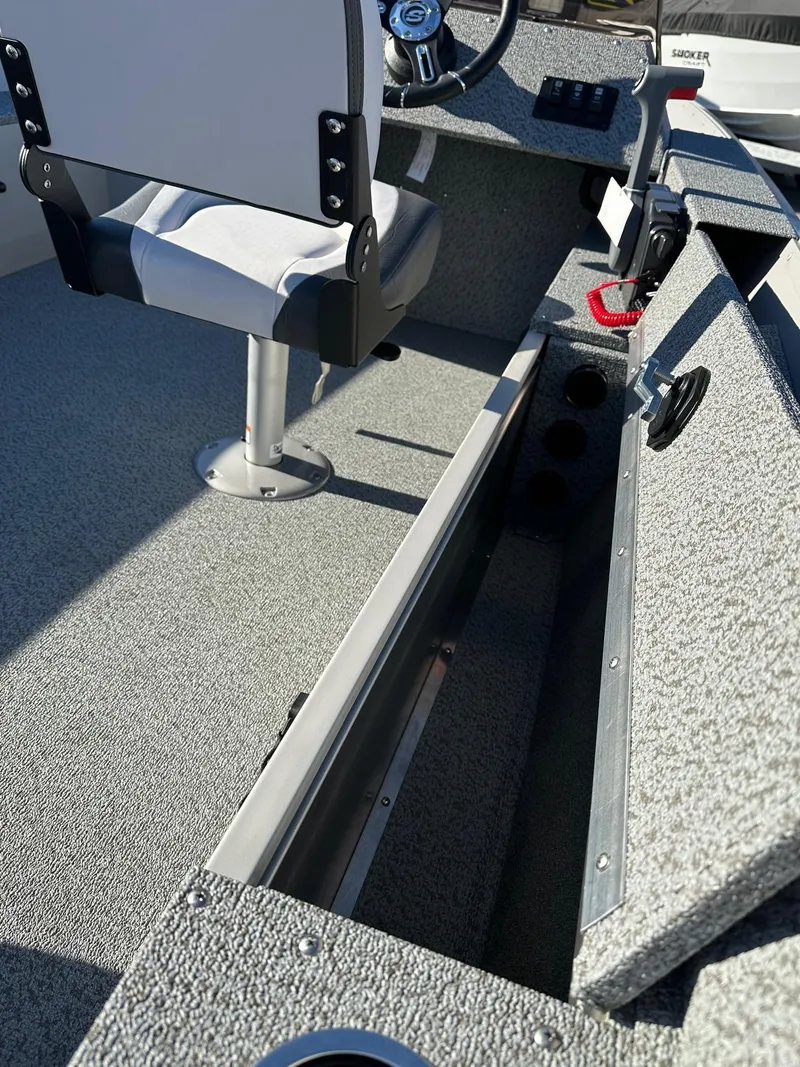Slide: The Image of 2025 Smoker Craft 16 Angler Patriot SC fishing boat interior with seating and storage. - 5