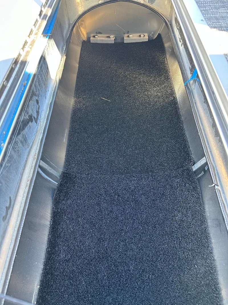 Slide: The Image of Interior view of 2025 Bennington 20 SSB SwingBack Tritoon storage compartment. - 11