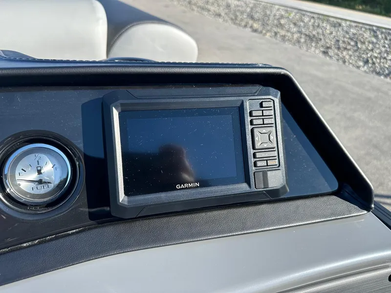 Slide: The Image of Dashboard of 2025 Bennington 20 SSB Tritoon with Garmin display and fuel gauge. - 13