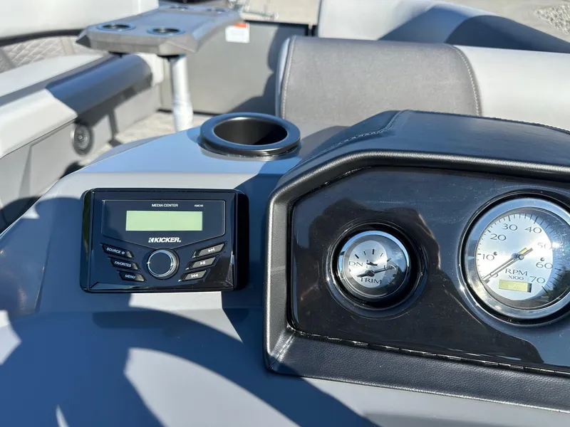 Slide: The Image of Dashboard of 2025 Bennington 20 SSB Tritoon with media center and gauges. - 22