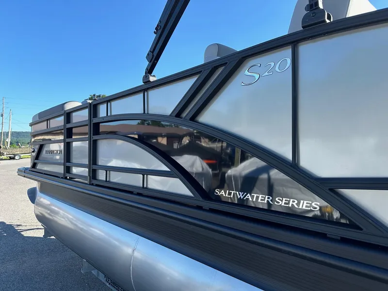 Slide: The Image of 2025 Bennington 20 SSB SwingBack Tritoon, Saltwater Series, side view under clear blue sky. - 4