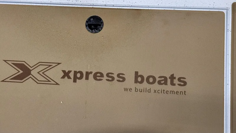 Slide: The Image of Xpress Boats logo with slogan 'we build xcitement' on H18C Crappie model, 2025. - 17