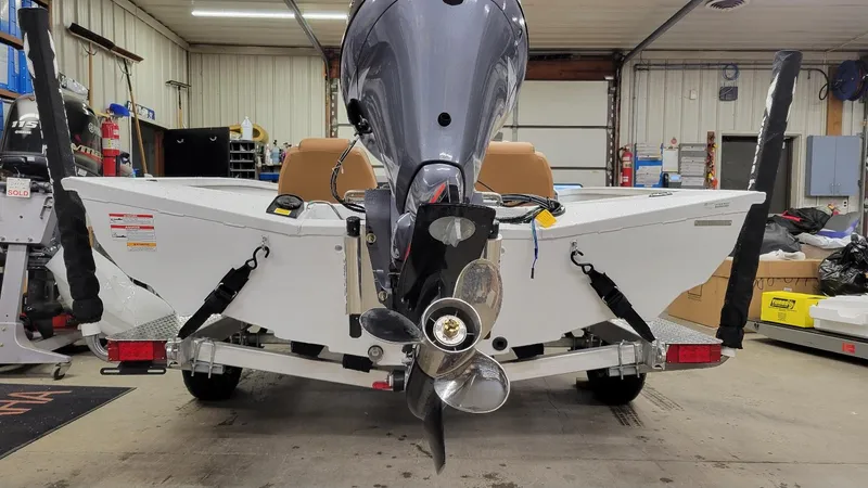 Slide: The Image of 2025 Xpress H18C Crappie boat with Yamaha Vmax 115 engine in a garage setting. - 4