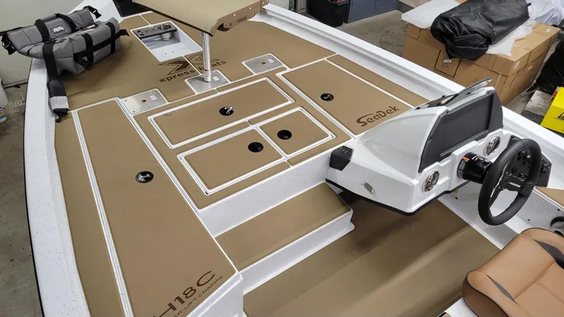 Slide: The Image of 2025 Xpress H18C Crappie boat interior with Yamaha Vmax 115, featuring SeaDek flooring. - 5