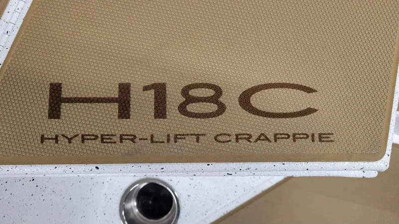 Slide: The Image of 2025 Xpress H18C Hyper-Lift Crappie boat deck with textured surface. - 8