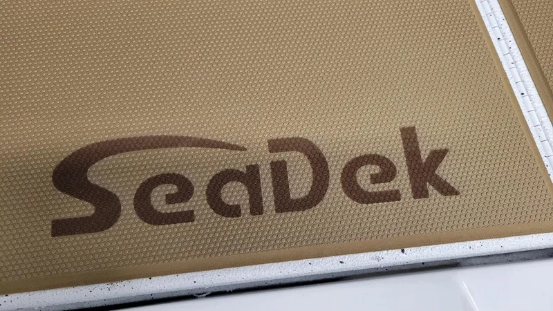 Slide: The Image of SeaDek logo on textured surface of 2025 Xpress H18C Crappie boat. - 9