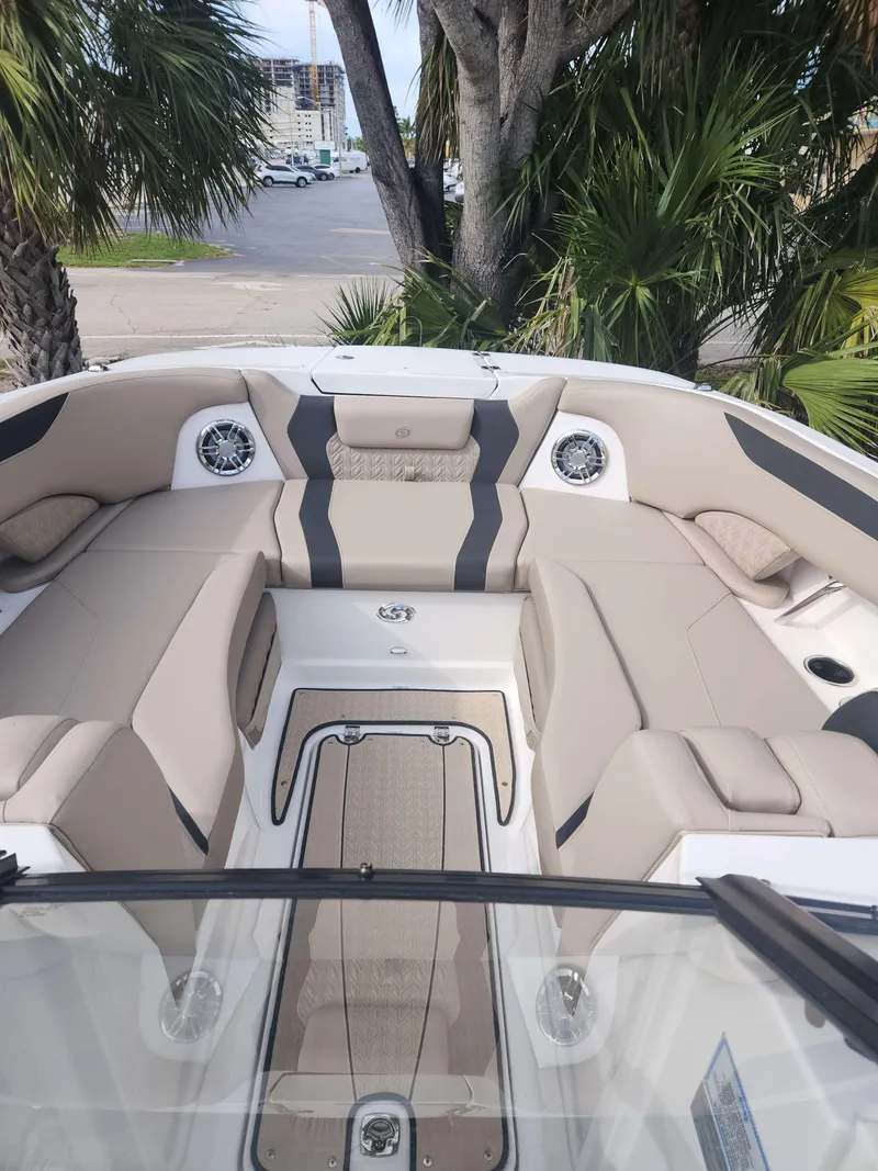Slide: The Image of 2024 Hurricane 2600 SD boat interior with beige seating and modern design. - 8