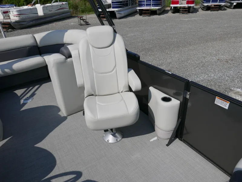 Slide: The Image of 2023 Sylvan Mirage X X3 boat interior with plush seating and cup holder. - 10