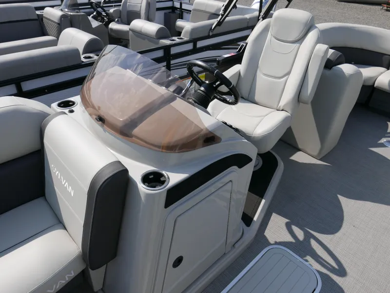 Slide: The Image of 2023 Sylvan Mirage X X3 boat interior with sleek seating and modern dashboard design. - 12