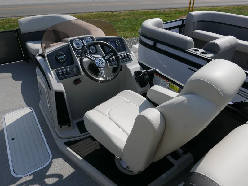 Slide: The Image of 2023 Sylvan Mirage X X3 boat interior with steering console and seating. - 13