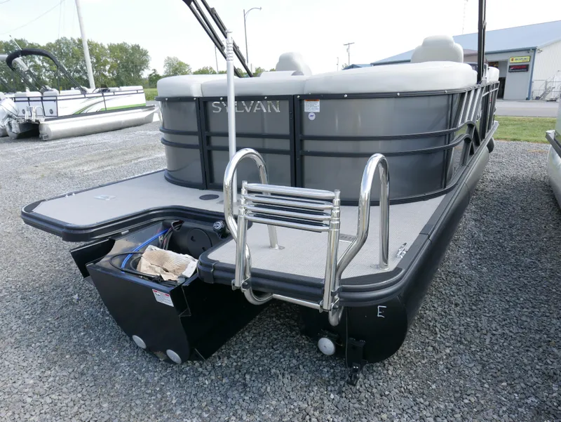Slide: The Image of 2023 Sylvan Mirage X X3 pontoon boat with rear ladder and sleek design. - 3