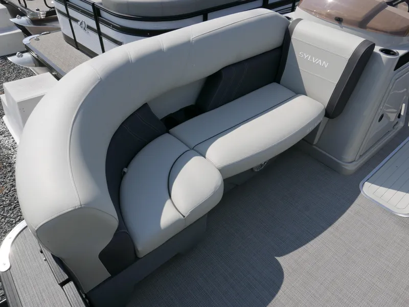 Slide: The Image of 2023 Sylvan Mirage X X3 boat with plush gray seating and modern design. - 6