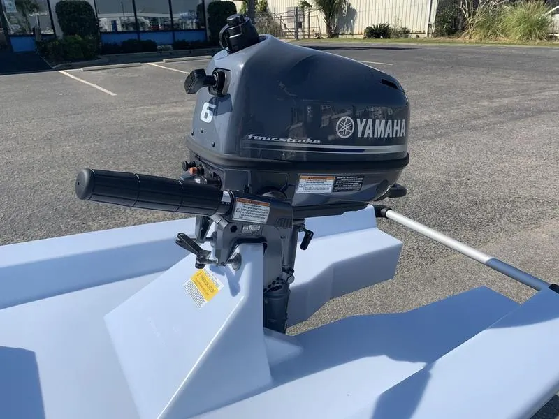 Slide: The Image of 2023 Solo Skiff 14 with Yamaha 6HP outboard motor in parking lot. - 11