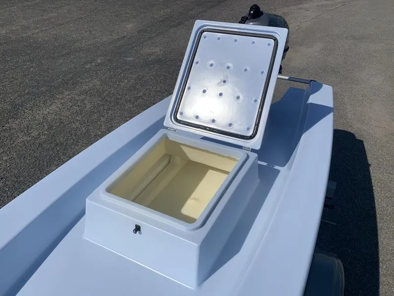 Slide: The Image of 2023 Solo Skiff 14 with open storage compartment on deck. - 8