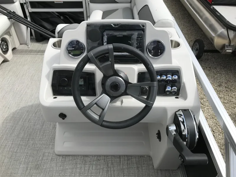 Slide: The Image of 2024 Avalon VTX Cruise pontoon boat interior with gray and white seating. - 10