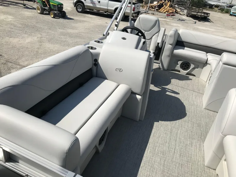 Slide: The Image of 2024 Avalon VTX Cruise pontoon boat with luxurious white seating and spacious interior. - 15