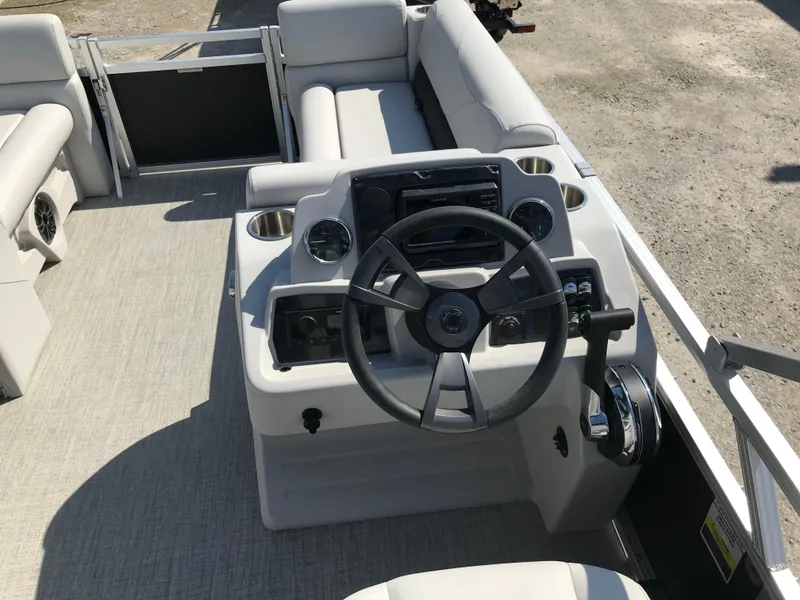 Slide: The Image of 2024 Avalon VTX Cruise boat interior with steering wheel and control panel. - 20