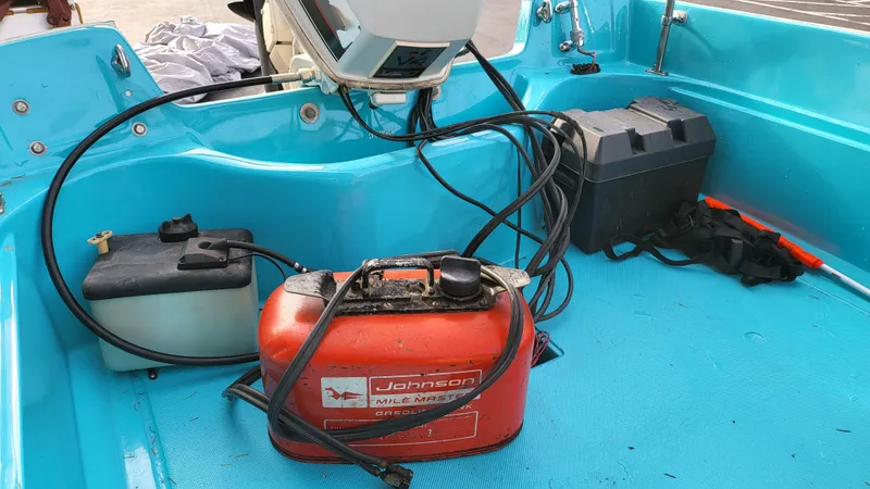 Slide: The Image of 1968 Boston Whaler 16 Sakonnet boat interior with fuel tank and battery. - 16