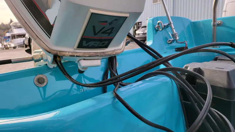 Slide: The Image of 1968 Boston Whaler 16 Sakonnet with V4 outboard motor, close-up view. - 17