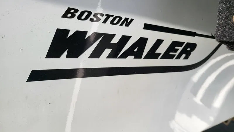 Slide: The Image of 1968 Boston Whaler 16 Sakonnet logo on boat hull - 23