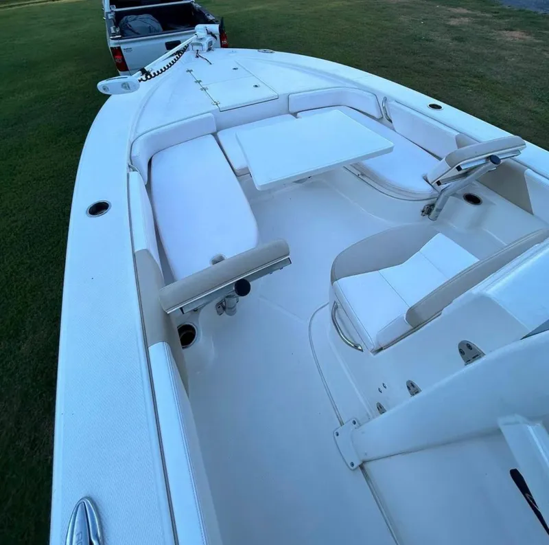 Slide: The Image of 2019 Robalo 246 Cayman boat interior with seating and table. - 4