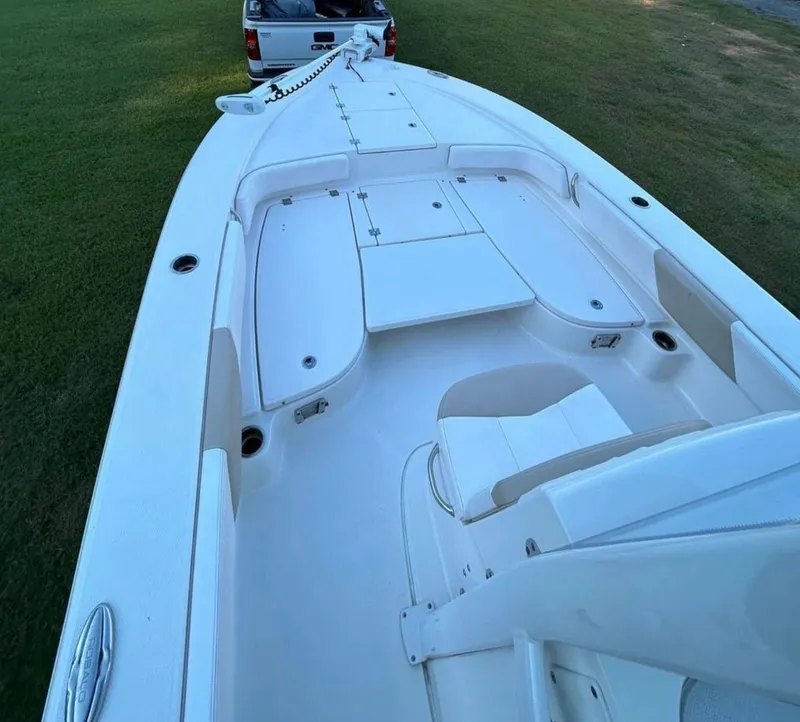Slide: The Image of 2019 Robalo 246 Cayman boat interior, white deck, and seating area. - 5