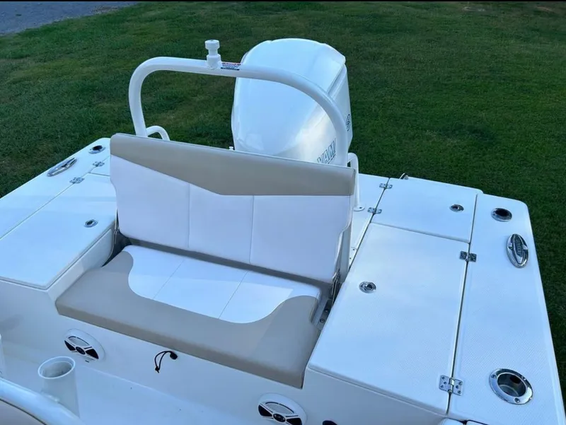 Slide: The Image of 2019 Robalo 246 Cayman boat with white and beige seating. - 7