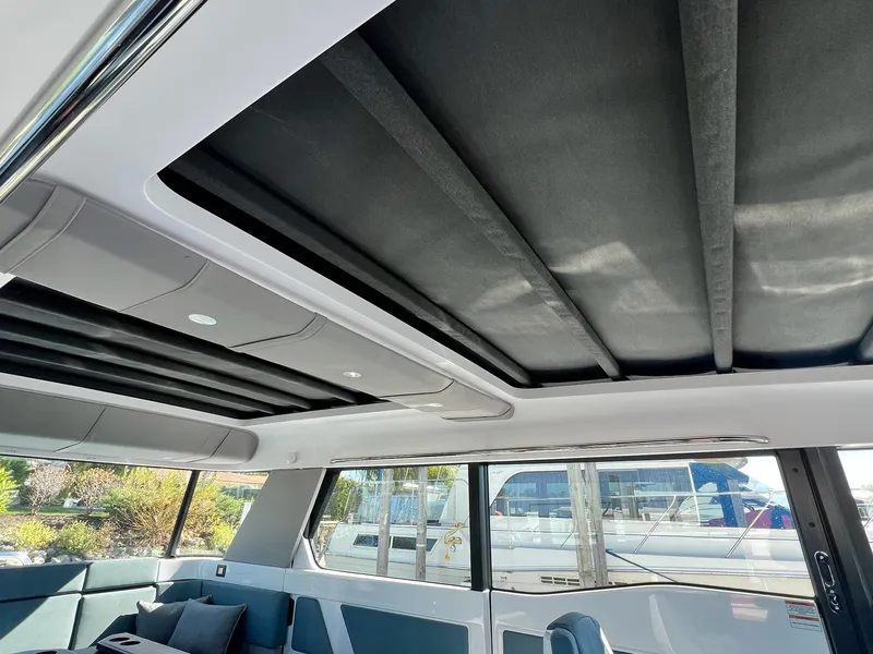 Slide: The Image of Interior view of 2024 Axopar 45 XC Cross Cabin with sleek design and panoramic windows. - 12