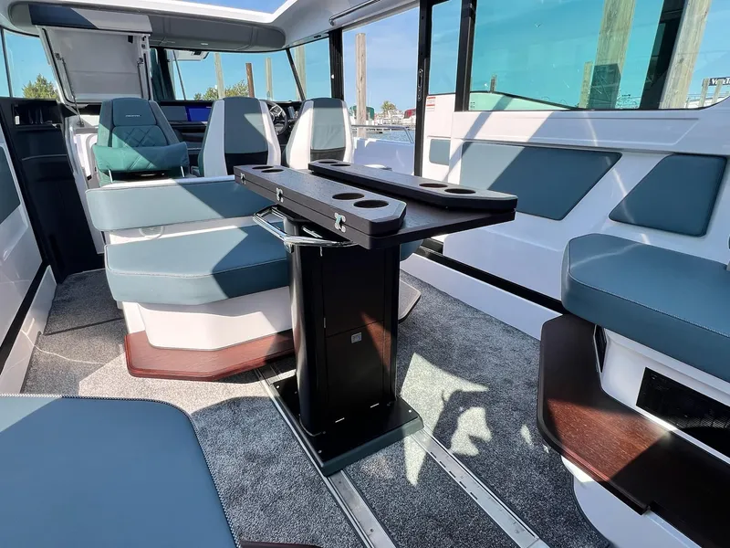 Slide: The Image of 2024 Axopar 45 XC Cross Cabin interior with modern seating and sleek design. - 16