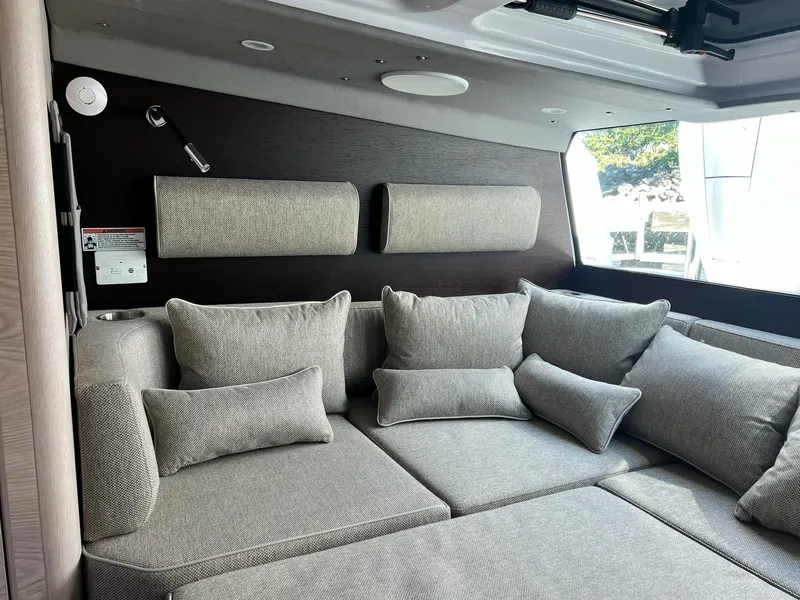 Slide: The Image of Luxurious interior of 2024 Axopar 45 XC Cross Cabin with plush gray seating. - 23