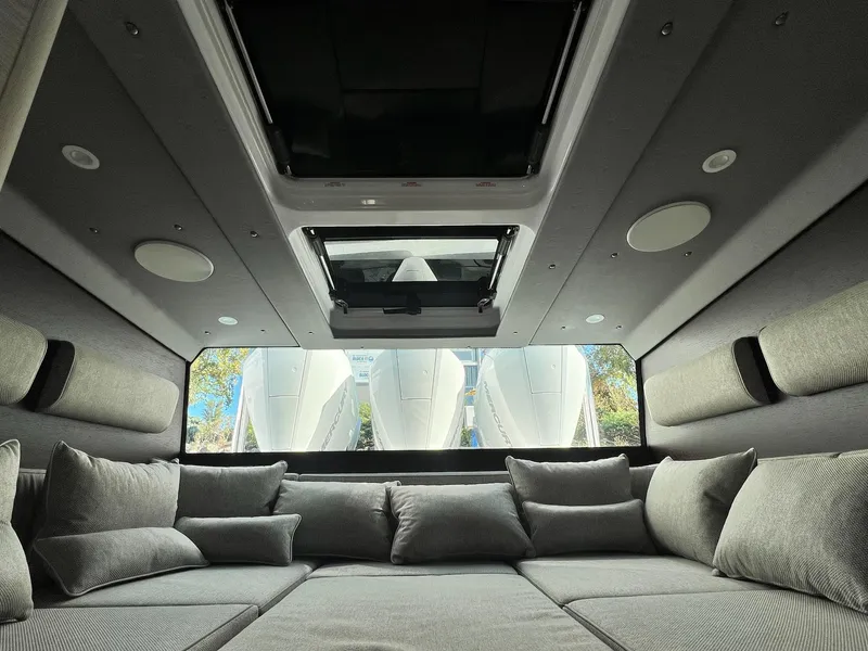 Slide: The Image of Luxurious interior of 2024 Axopar 45 XC Cross Cabin with plush seating and skylight. - 24