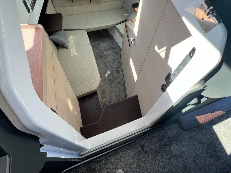 Slide: The Image of Interior of 2024 Axopar 45 XC Cross Cabin, featuring modern seating and sleek design. - 34